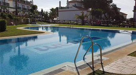 Lomas de cabopino | frontline golf townhouse for sale swimming pool
