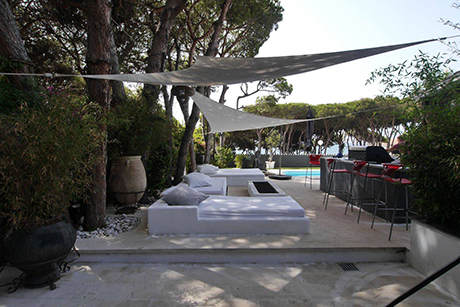 seating at pool detached beachside villa in Cabopino