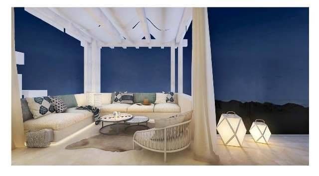 image of outside seating at nighttime new golf villas apartments and penthouses Marbella